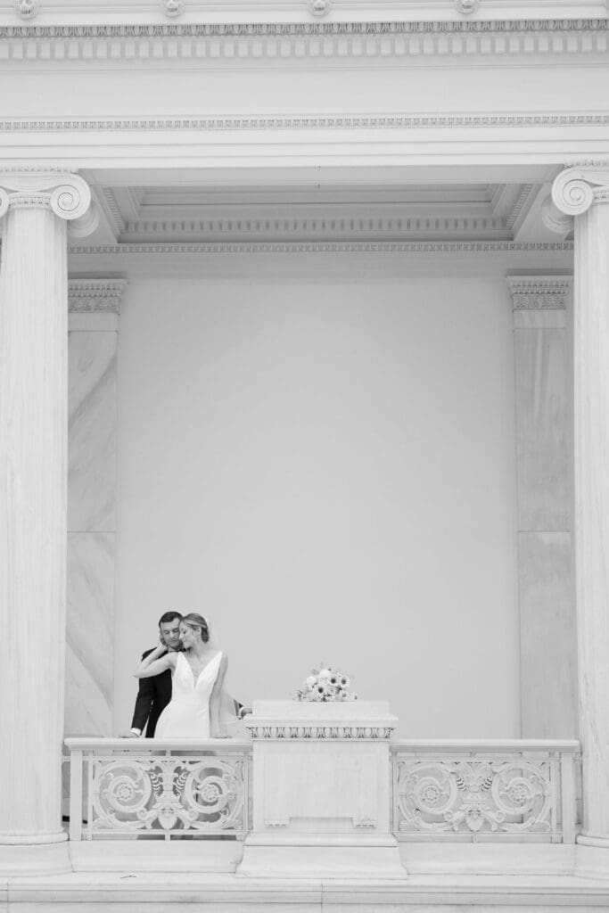 black and white image of bride and groom in museum wedding