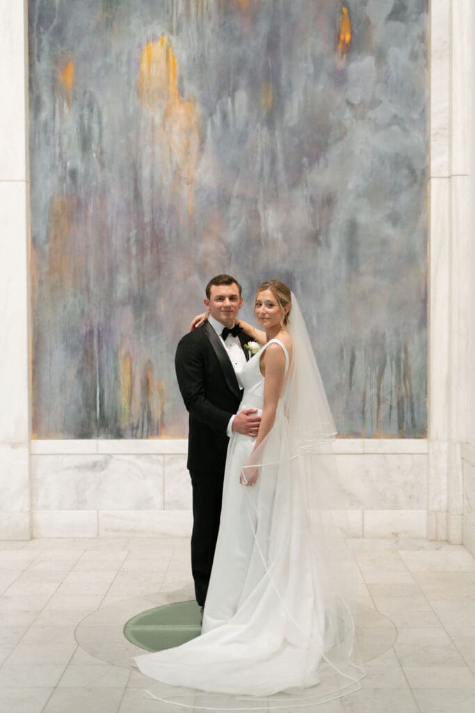 museum wedding bride and groom with art