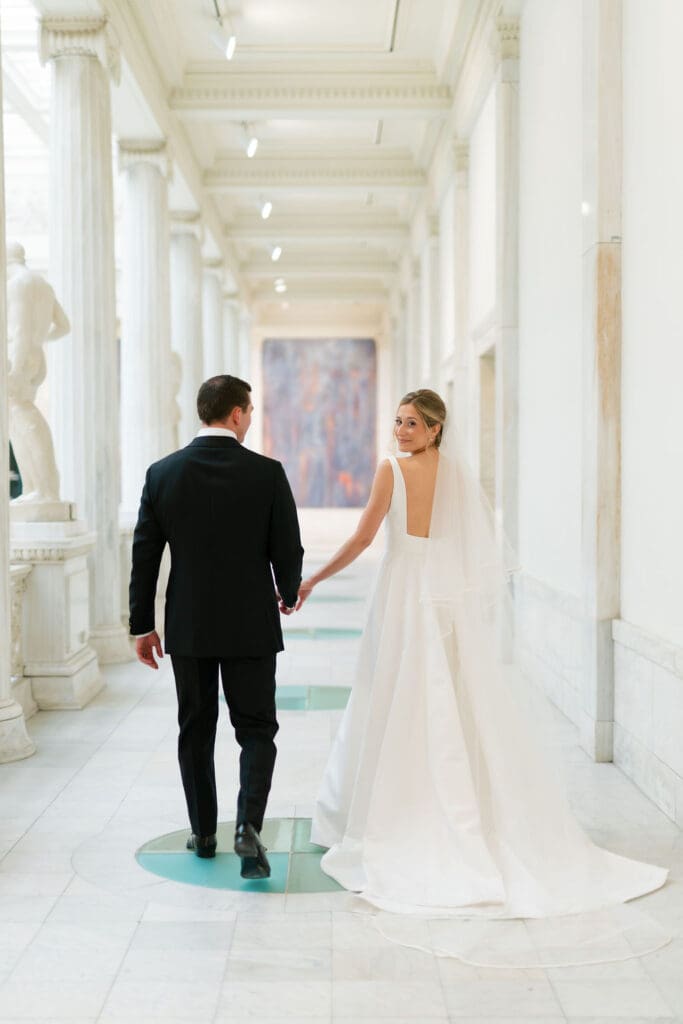 museum wedding bride and groom in gallery
