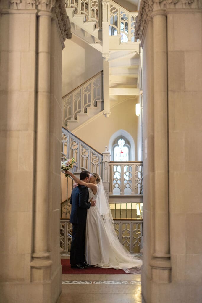 bride and groom kissing at museum wedding in pittsburgh
