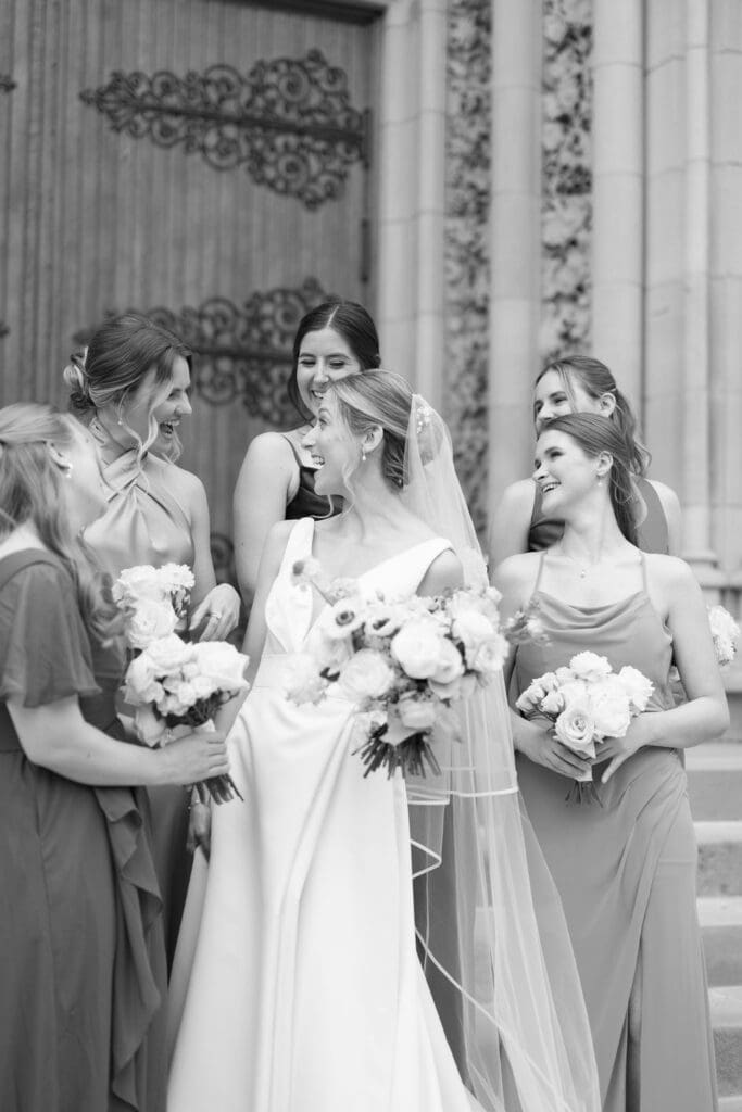 black and white photo of bride with friends